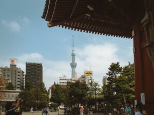 Scenic view of Tokyo Skytree framed by Senso-ji Temple architecture and city landscape.